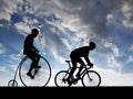 Silhouette cyclists on bicycles