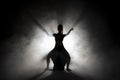 Silhouette dancer performing dance figures. Royalty Free Stock Photo