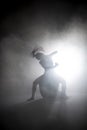 Silhouette dancer performing dance figures. Royalty Free Stock Photo