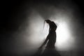 Silhouette dancer performing dance figures. Royalty Free Stock Photo