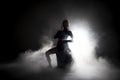 Silhouette dancer performing dance figures. Royalty Free Stock Photo