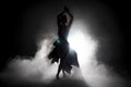 Silhouette dancer performing dance figures. Royalty Free Stock Photo