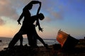 Silhouette dancers beside sea Royalty Free Stock Photo