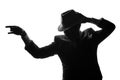 Silhouette of dancing private detective. Agent stay side to camera and looks like mafioso Al Capone. Criminal or mob scene. Studio Royalty Free Stock Photo