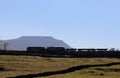 Silhouette of diesel locomotives with mountain