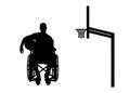 Silhouette of a disabled basketball player in a wheelchair holding the ball in his hand Royalty Free Stock Photo