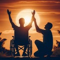 silhouette of disabled handicapped young man in wheelchair raised hands with his care helper in sunset