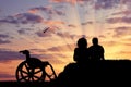 Silhouette of disabled person with the guardian