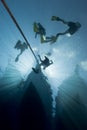 Silhouette of divers and dive boat. Royalty Free Stock Photo