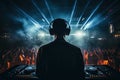 Silhouette of dj with headphones listening to music in a nightclub, rear view DJ with headphones at a nightclub party, AI Royalty Free Stock Photo