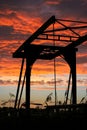 Silhouette of a drawbridge in Holland against a fiery red sky. Royalty Free Stock Photo