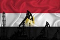 Silhouette of drilling rigs and oil derricks on the background of the flag of Egypti. Oil and gas industry. The concept of oil