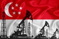 Silhouette of drilling rigs and oil derricks on the background of the flag of Singapore. Oil and gas industry. The concept of oil