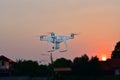 Silhouette drone fly for take aerial photo at sunset evening ora