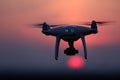 Silhouette of drone in the sky, orange sunset Royalty Free Stock Photo