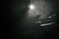 The silhouette of a drummer playing a drum kit on stage in the rays of light from spotlights Royalty Free Stock Photo