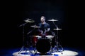 Silhouette drummer on stage. Dark background, smoke spotlights. Royalty Free Stock Photo