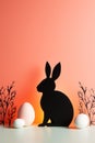 Silhouette of Easter bunny with pastel sunset backdrop