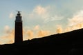 The silhouette of the `Eierland` lighthouse on wadden sea island Texel in the Netherlands with a beautiful evening sky Royalty Free Stock Photo