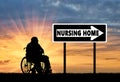 Silhouette of an elderly man in a wheelchair