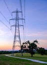Silhouette electric pole and high voltage tower. Royalty Free Stock Photo