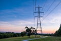 Silhouette electric pole and high voltage tower. Royalty Free Stock Photo