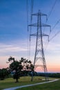 Silhouette electric pole and high voltage tower. Royalty Free Stock Photo