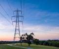 Silhouette electric pole and high voltage tower. Royalty Free Stock Photo