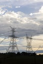 Silhouette of electric power towers during dusk Royalty Free Stock Photo