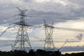 Silhouette of electric power towers during dusk Royalty Free Stock Photo