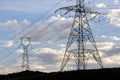 Silhouette of electric power towers during dusk Royalty Free Stock Photo