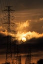 Silhouette electrical power tower with sunlight