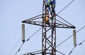 Silhouette electrician work installation of high voltage in high voltage stations safely and systematically over blurred natural b