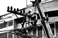 Silhouette electrician working on electricity post