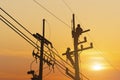 Silhouette electrician working on high voltage