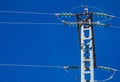 Silhouette electricity post on the background of blue sky