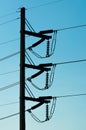 A Silhouette of Electricity post in dark blue sky background Royalty Free Stock Photo