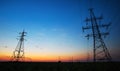 Silhouette of electricity pylons and high-voltage power Royalty Free Stock Photo