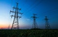 Silhouette of electricity pylons and high-voltage power lines Royalty Free Stock Photo