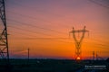 Silhouette electricity pylons