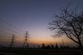 Silhouette electricity pylons