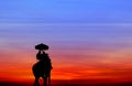 Silhouette elephant with tourist at sunset Royalty Free Stock Photo
