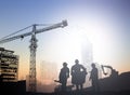 Silhouette engineer in a building site over Blurred constructio Royalty Free Stock Photo