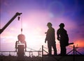Silhouette engineer in a building site over Blurred constructio Royalty Free Stock Photo