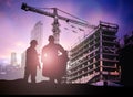 Silhouette engineer in a building site over Blurred constructio Royalty Free Stock Photo