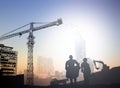 Silhouette engineer in a building site over Blurred constructio Royalty Free Stock Photo