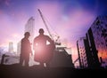 Silhouette engineer in a building site over Blurred constructio Royalty Free Stock Photo