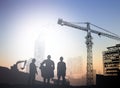 Silhouette engineer in a building site over Blurred constructio Royalty Free Stock Photo