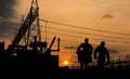 Silhouette of engineer looking at blueprints in a building site Royalty Free Stock Photo