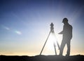 Silhouette engineer looking Loaders and trucks in a building sit Royalty Free Stock Photo